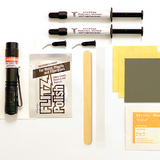 Collection of surface restoration tools and materials on a white background