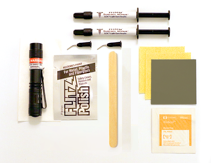 Collection of surface restoration tools and materials on a white background