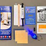 Kit components include : a syringe of LCA™ clear, Flitz polish paste packet, LED curing light, a LED Light Stand, a wood application tool, a non-scratch sandpaper, a curing strip, a micro tip, an alcohol preparation pad, multi language repair instructions