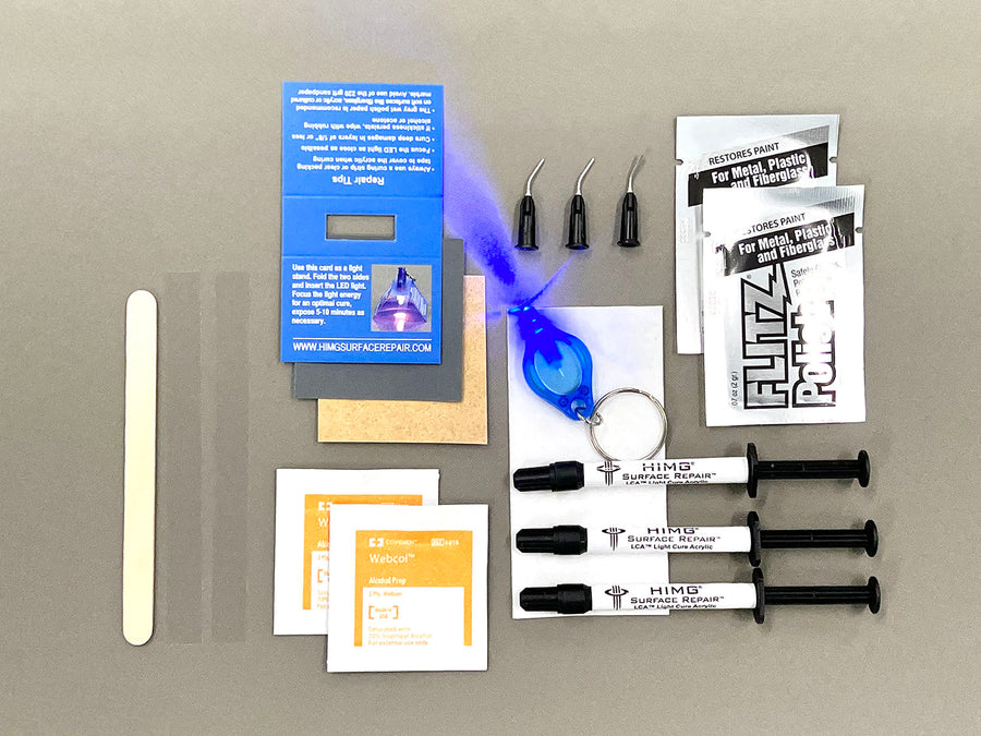 This kit includes:  • Three 1 gram syringes of Light Cure Acrylic™ in Grey, Whisper Grey and Thunder • 2 Packets of Flitz Polish Paste • 1 LED Curing Light • 1 LED Light Stand • Wood Application Tool • Non-Scratch Sandpaper • 2 curing strips • 3 micro tips • 2 Alcohol Prep Pads • Multi language repair instructions