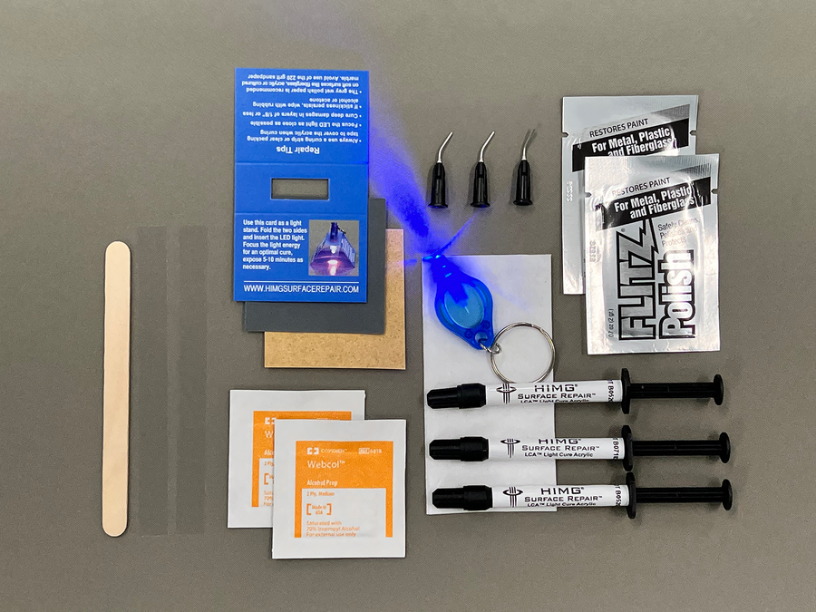 This kit includes:  • Three 1 gram syringes of Light Cure Acrylic™ in Thunder, Whisper Grey and Grey • 2 Packets of Flitz Polish Paste • 1 LED Curing Light • 1 LED Light Stand • Wood Application Tool • Non-Scratch Sandpaper • 2 curing strips • 3 micro tips • 2 Alcohol Prep Pads • Multi language repair instructions